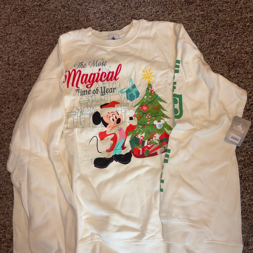 Disney cream sweatshirt with black logo tag